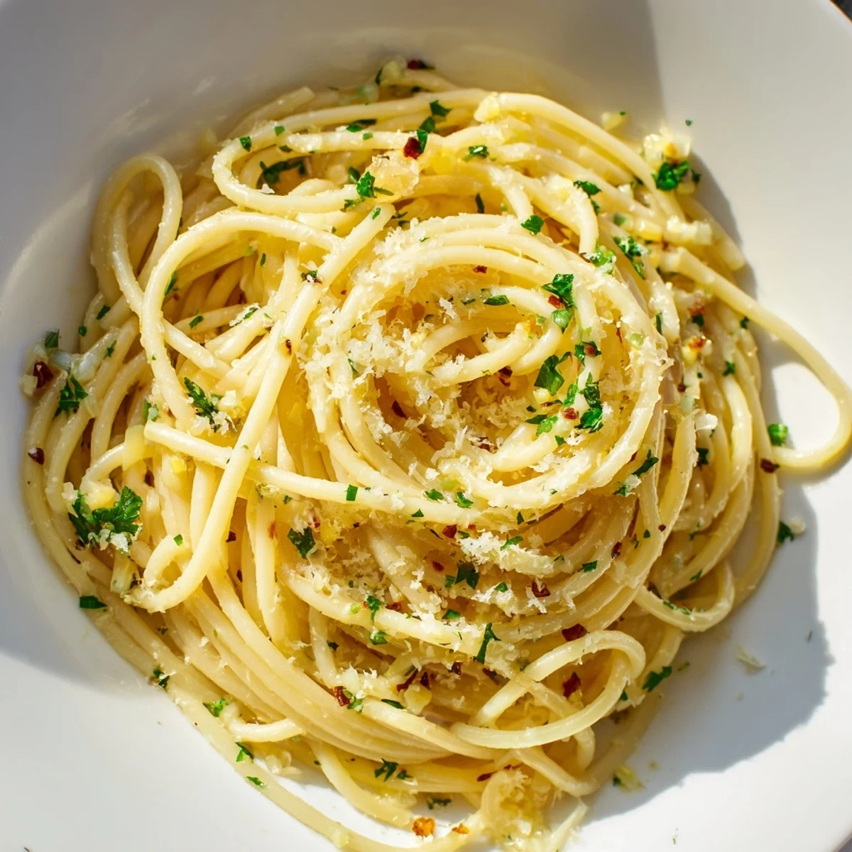 Close-up of savory Garlic Butter Noodles, a vegetarian dish with parmesan and lemon zest.