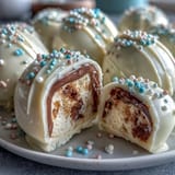 White chocolate-covered peanut butter eggs with colorful sprinkles are a delightful and easy Easter dessert for all ages.