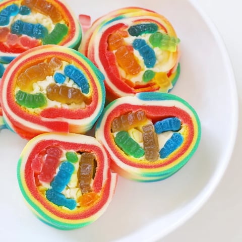 Vibrant Rainbow Candy Roll Ups: Chewy, colorful pinwheels with visible gummy candy filling that tempt taste buds!