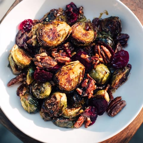 Savory, caramelized Winter Roasted Brussels Sprouts, topped with pecans – a perfect holiday dish.