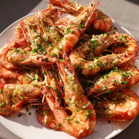 Tender shrimp in a creamy garlic sauce, perfect for a cozy weeknight dinner, ready to eat.
