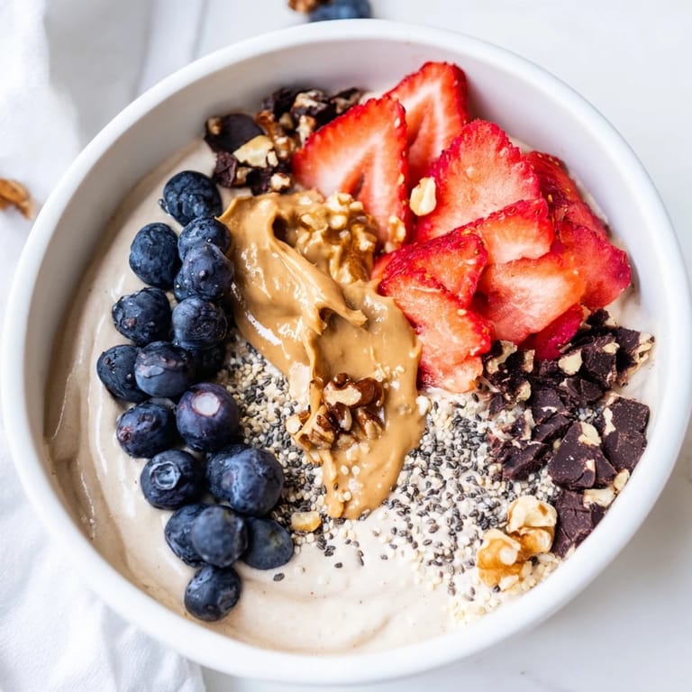 Indulge in this delicious Ninja Creami-style Protein Ice Cream Bowl, ready in minutes with your own flavors.