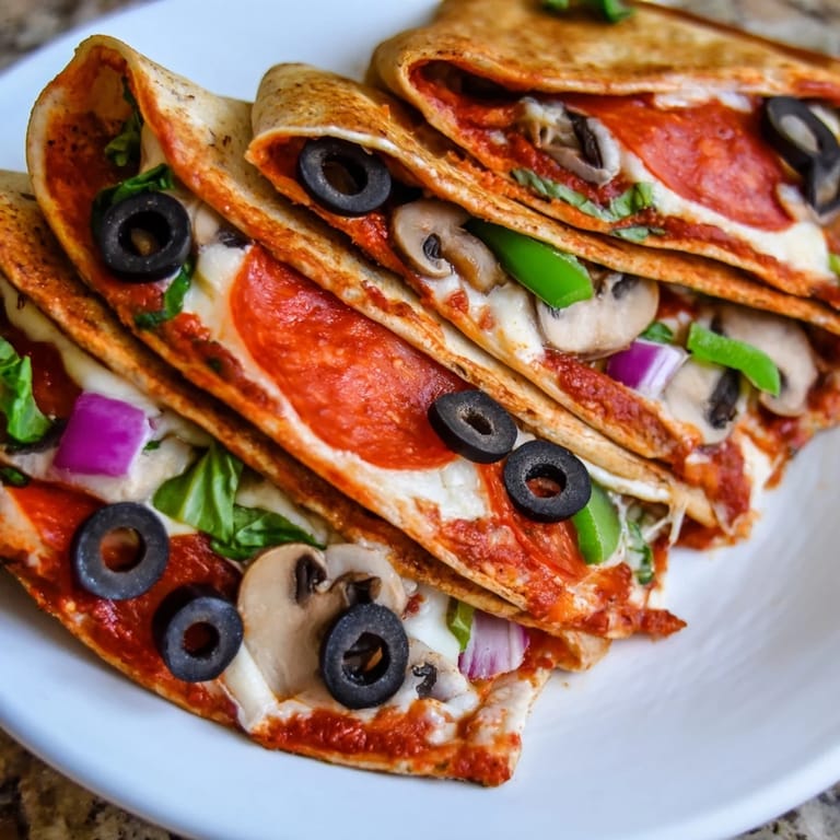 Golden, melty tortilla pizza wrap, oozing cheese, alongside fresh basil sprigs for garnish.
