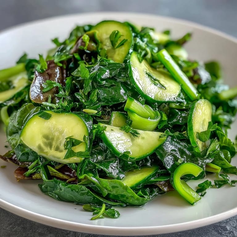Close-up of the Glowing Green Salad featuring hydrating cucumber, green bell pepper, and fresh parsley.  