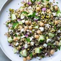 Jennifer Aniston Salad with vibrant colors, feta crumbles, and fresh herbs ready to enjoy.